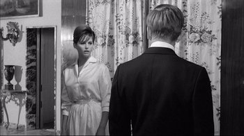 Movie still from “Girl with a Suitcase” (1961), directed by Valerio Zurlini – A man and a woman looking at each other in a mirror; Medium shot, Over the shoulder angle