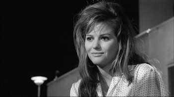 Movie still from “Girl with a Suitcase” (1961), directed by Valerio Zurlini – A black and white photo of a woman with long hair; Close Up shot, Low angle