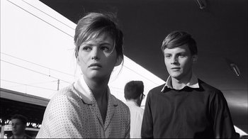 Movie still from “Girl with a Suitcase” (1961), directed by Valerio Zurlini – A man and a woman standing next to each other; Close Up shot, Low angle