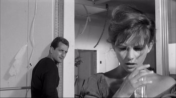 Movie still from “Girl with a Suitcase” (1961), directed by Valerio Zurlini – A man and a woman standing next to each other in a room; Close Up shot, Over the shoulder angle