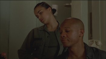 Movie still from “Girlfight” (2000), directed by Karyn Kusama – A man and a woman are standing in a room; Close Up shot, Low angle