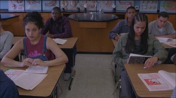 Movie still from “Girlfight” (2000), directed by Karyn Kusama – A group of people sitting at tables in a classroom; Medium shot, High angle