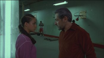 Movie still from “Girlfight” (2000), directed by Karyn Kusama – A man and a woman talking in a boxing gym; Medium shot, Over the shoulder angle