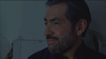 Movie still from “Girlfight” (2000), directed by Karyn Kusama – A person with a beard looking up; Close Up shot, Low angle