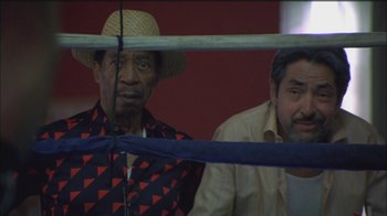 Movie still from “Girlfight” (2000), directed by Karyn Kusama – Two men are standing in a boxing ring together; Close Up shot, High angle