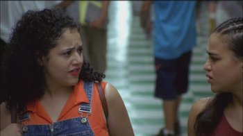Movie still from “Girlfight” (2000), directed by Karyn Kusama – A woman with a red shirt is looking at the camera; Close Up shot, Over the shoulder angle