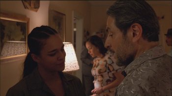 Movie still from “Girlfight” (2000), directed by Karyn Kusama – A man and a woman standing next to each other in a room; Close Up shot, Over the shoulder angle