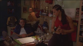 Movie still from “Girlfight” (2000), directed by Karyn Kusama – A man and a woman sitting at a dining table; Medium shot, Over the shoulder angle