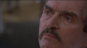 Movie still from “Girlfight” (2000), directed by Karyn Kusama – A man with a mustache; Close Up shot, Low angle