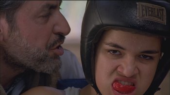 Movie still from “Girlfight” (2000), directed by Karyn Kusama – A man and a woman in a boxing ring; Close Up shot, Low angle