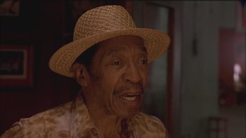 Movie still from “Girlfight” (2000), directed by Karyn Kusama – An older man wearing a straw hat; Close Up shot, Low angle