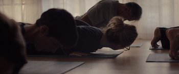 Movie still from “Gloria Bell” (2018), directed by Sebastián Lelio – Two people are practicing yoga on a mat; Close Up shot, Over the shoulder angle