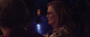 Movie still from “Gloria Bell” (2018), directed by Sebastián Lelio – A woman sitting at a bar looking off into the distance; Close Up shot, Over the shoulder angle