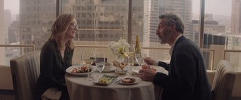 Movie still from “Gloria Bell” (2018), directed by Sebastián Lelio – A man and a woman sitting at a dinner table; Medium shot, Over the shoulder angle