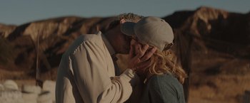 Movie still from “Gloria Bell” (2018), directed by Sebastián Lelio – A man and a woman kissing in a field; Close Up shot, Over the shoulder angle