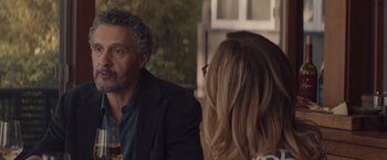 Movie still from “Gloria Bell” (2018), directed by Sebastián Lelio – A man and a woman are sitting at a table; Medium shot, Over the shoulder angle