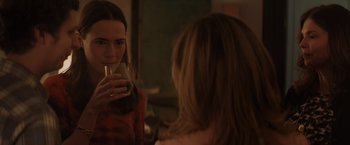 Movie still from “Gloria Bell” (2018), directed by Sebastián Lelio – A woman drinking a glass of water in front of a mirror; Close Up shot, Over the shoulder angle