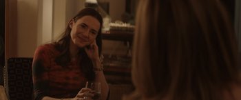 Movie still from “Gloria Bell” (2018), directed by Sebastián Lelio – A woman sitting in front of a mirror holding a wine glass; Close Up shot, Over the shoulder angle