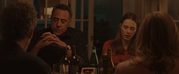Movie still from “Gloria Bell” (2018), directed by Sebastián Lelio – A man and a woman sitting at a dinner table; Medium shot, Over the shoulder angle