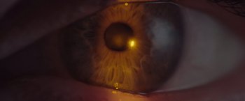 Movie still from “Gloria Bell” (2018), directed by Sebastián Lelio – An image of an eye that is lit up; Extreme Close Up shot, Overhead angle