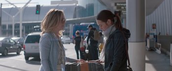 Movie still from “Gloria Bell” (2018), directed by Sebastián Lelio – Two women looking at a piece of paper on the street; Medium shot, Over the shoulder angle
