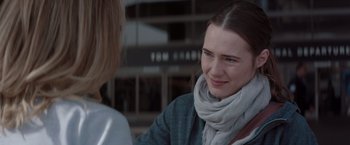 Movie still from “Gloria Bell” (2018), directed by Sebastián Lelio – A woman wearing a gray jacket and a gray scarf; Close Up shot, Over the shoulder angle