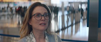 Movie still from “Gloria Bell” (2018), directed by Sebastián Lelio – A person wearing glasses; Close Up shot, Over the shoulder angle
