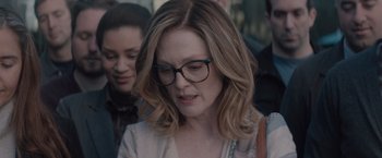 Movie still from “Gloria Bell” (2018), directed by Sebastián Lelio – A person wearing glasses; Close Up shot, Over the shoulder angle
