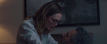 Movie still from “Gloria Bell” (2018), directed by Sebastián Lelio – A woman wearing glasses looking down at a man's face; Medium shot, Over the shoulder angle