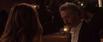 Movie still from “Gloria Bell” (2018), directed by Sebastián Lelio – A man and a woman are sitting at a table; Close Up shot, Over the shoulder angle