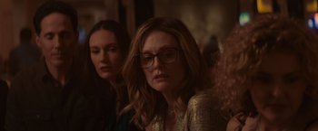 Movie still from “Gloria Bell” (2018), directed by Sebastián Lelio – A woman with glasses sitting next to another woman; Close Up shot, Over the shoulder angle