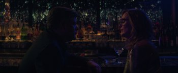Movie still from “Gloria Bell” (2018), directed by Sebastián Lelio – A man and a woman sitting at a table in a bar; Medium shot, Over the shoulder angle