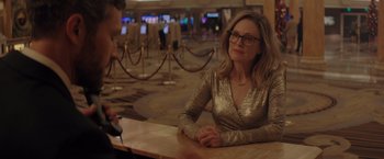 Movie still from “Gloria Bell” (2018), directed by Sebastián Lelio – A woman sitting at a table in front of a man; Medium shot, Over the shoulder angle