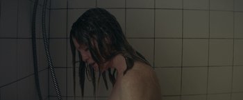 Movie still from “Gloria Bell” (2018), directed by Sebastián Lelio – A woman is taking a shower in a bathroom; Close Up shot, Overhead angle