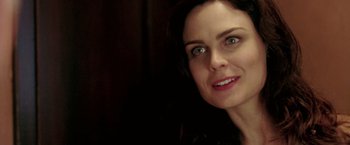 Movie still from “Glory Road” (2006), directed by James Gartner – A woman's face in a dark room; Close Up shot, Over the shoulder angle