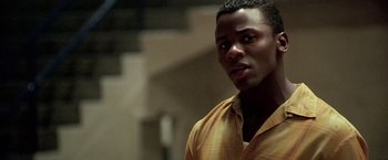 Movie still from “Glory Road” (2006), directed by James Gartner – A person wearing a yellow shirt; Close Up shot, Over the shoulder angle