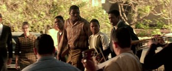 Movie still from “Glory Road” (2006), directed by James Gartner – A group of young men standing next to each other; Medium shot, Over the shoulder angle