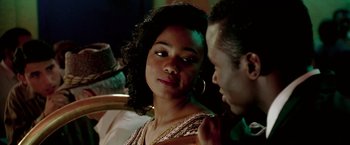 Movie still from “Glory Road” (2006), directed by James Gartner – A man and a woman sitting next to each other; Close Up shot, Over the shoulder angle