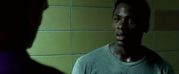 Movie still from “Glory Road” (2006), directed by James Gartner – A person in a gray shirt; Close Up shot, Over the shoulder angle