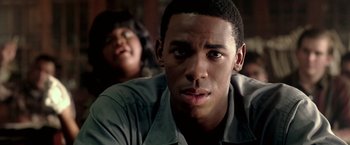 Movie still from “Glory Road” (2006), directed by James Gartner – A man and a woman are looking at the camera; Close Up shot, Over the shoulder angle