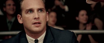 Movie still from “Glory Road” (2006), directed by James Gartner – A person wearing a suit and tie; Close Up shot, Over the shoulder angle