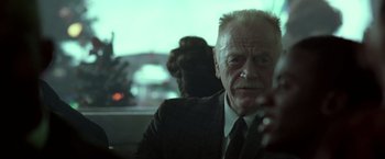 Movie still from “Glory Road” (2006), directed by James Gartner – An older man sitting in a car looking at the camera; Close Up shot, Over the shoulder angle