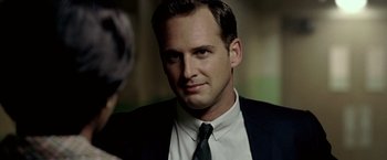 Movie still from “Glory Road” (2006), directed by James Gartner – A man in a suit and a tie; Close Up shot, Over the shoulder angle