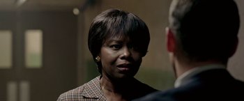 Movie still from “Glory Road” (2006), directed by James Gartner – A person wearing a jacket; Close Up shot, Over the shoulder angle