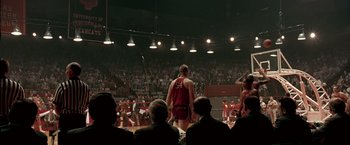 Movie still from “Glory Road” (2006), directed by James Gartner – A crowd of people watching a man in a wrestling outfit; Extreme Wide shot, High angle