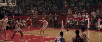 Movie still from “Glory Road” (2006), directed by James Gartner – A basketball game in progress with a crowd of people watching it; Wide shot, High angle