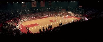 Movie still from “Glory Road” (2006), directed by James Gartner – A basketball game in progress in a large arena; Extreme Wide shot, High angle