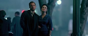 Movie still from “Glory Road” (2006), directed by James Gartner – A man and a woman standing next to each other; Medium shot, Low angle