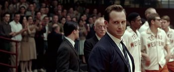 Movie still from “Glory Road” (2006), directed by James Gartner – A group of men standing in front of a crowd; Close Up shot, Over the shoulder angle