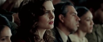 Movie still from “Glory Road” (2006), directed by James Gartner – A person wearing a suit and tie; Close Up shot, Over the shoulder angle